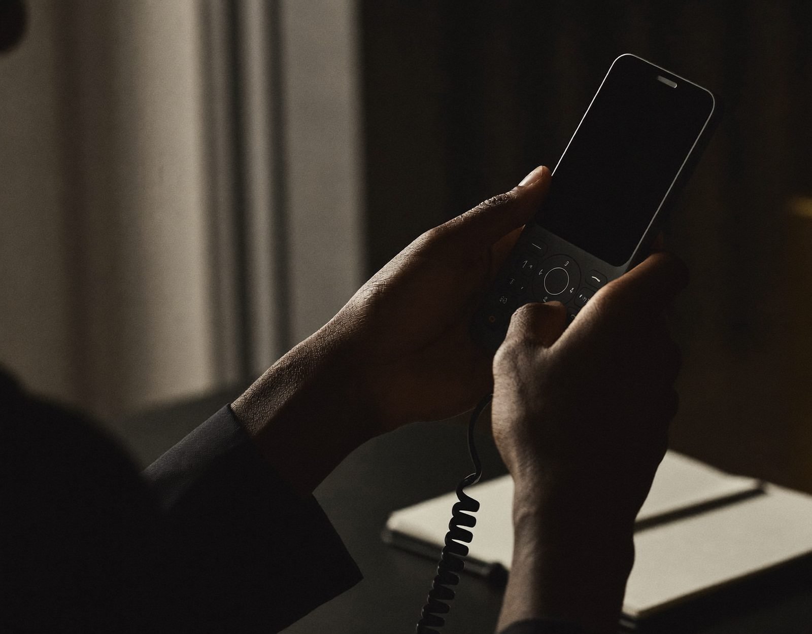 A desk phone under warm light — speed to lead in hospital patient acquisition